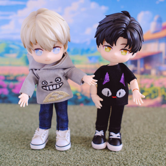Two dolls with stylized outfits against a colorful, cartoon-like background